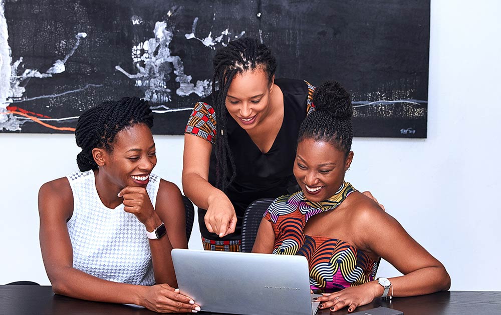 black women working on laptop