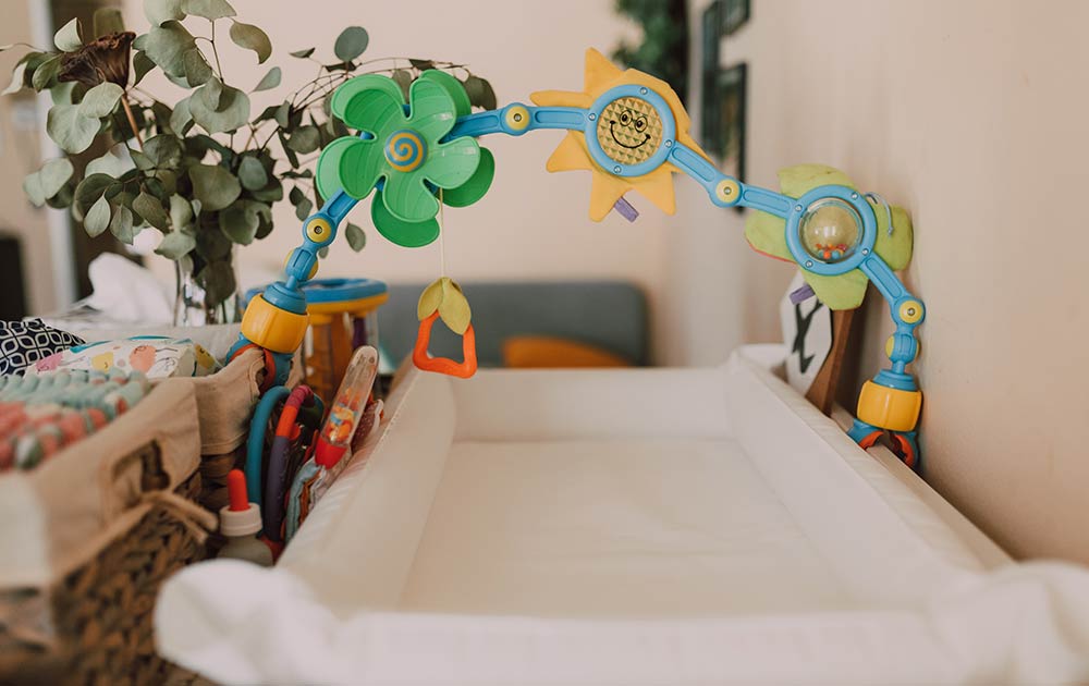 baby toys above changing table