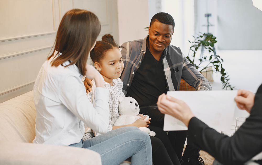 parents with child at therapy