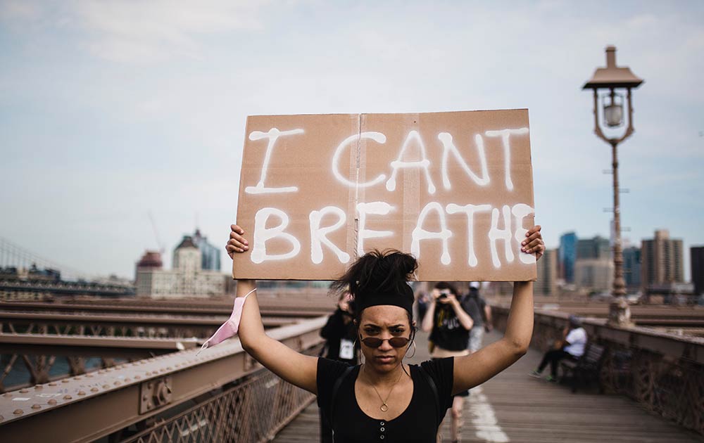 person holding protest sign